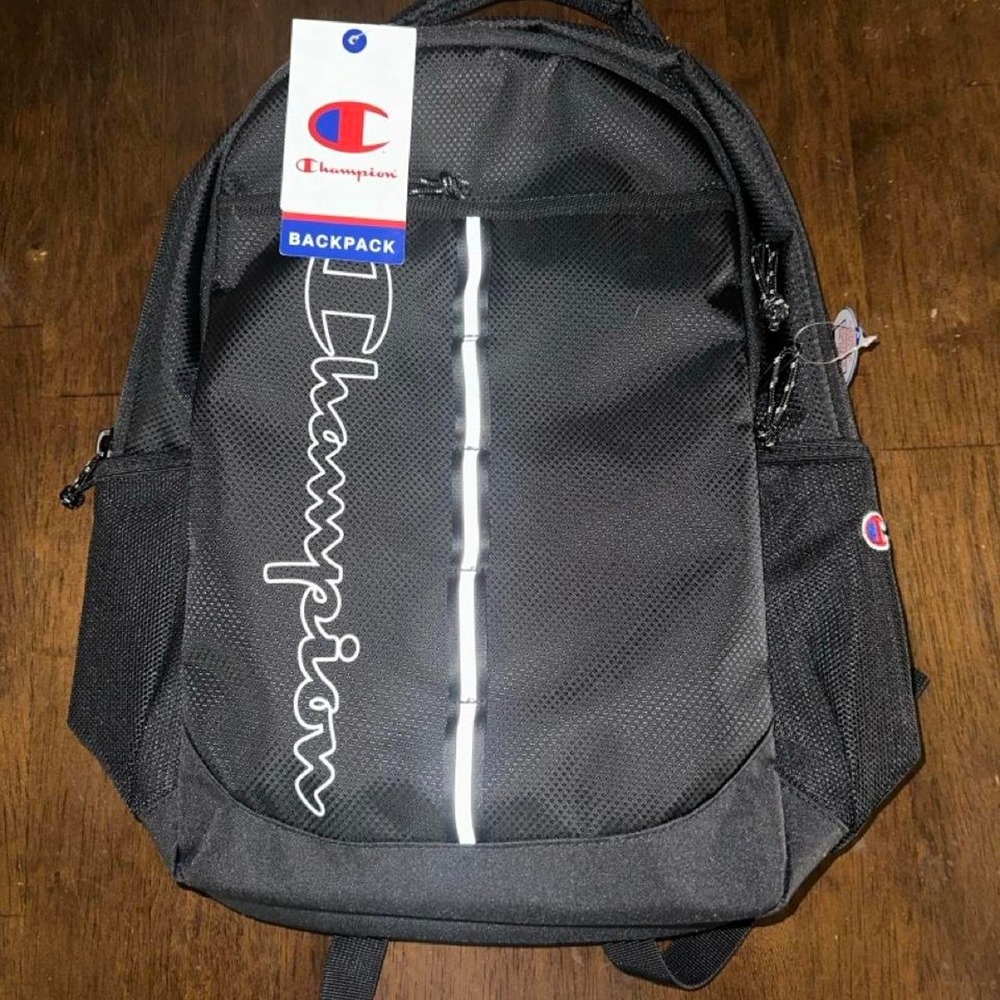 Champion black backpack with white vertical stripe and white 'Champion'